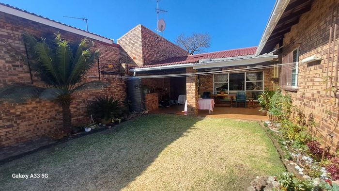 For Sale: Spacious Buccleuch Townhouse with Garden, Double Garage, and Kids' Play Area