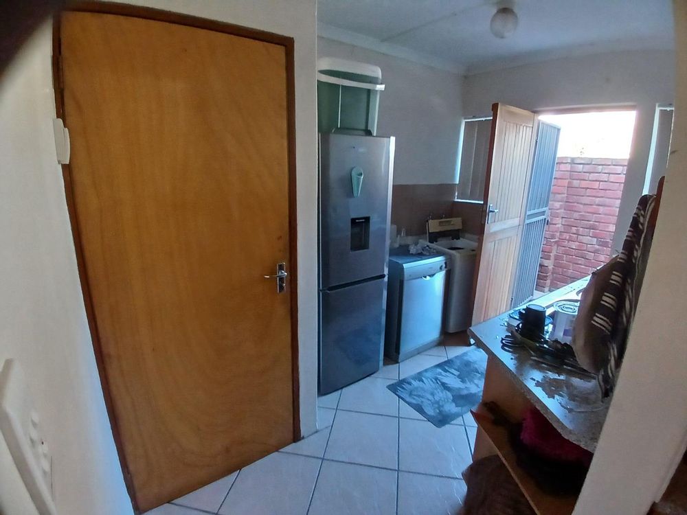 Spacious Scullery/Laundry - accessed via Kitchen.