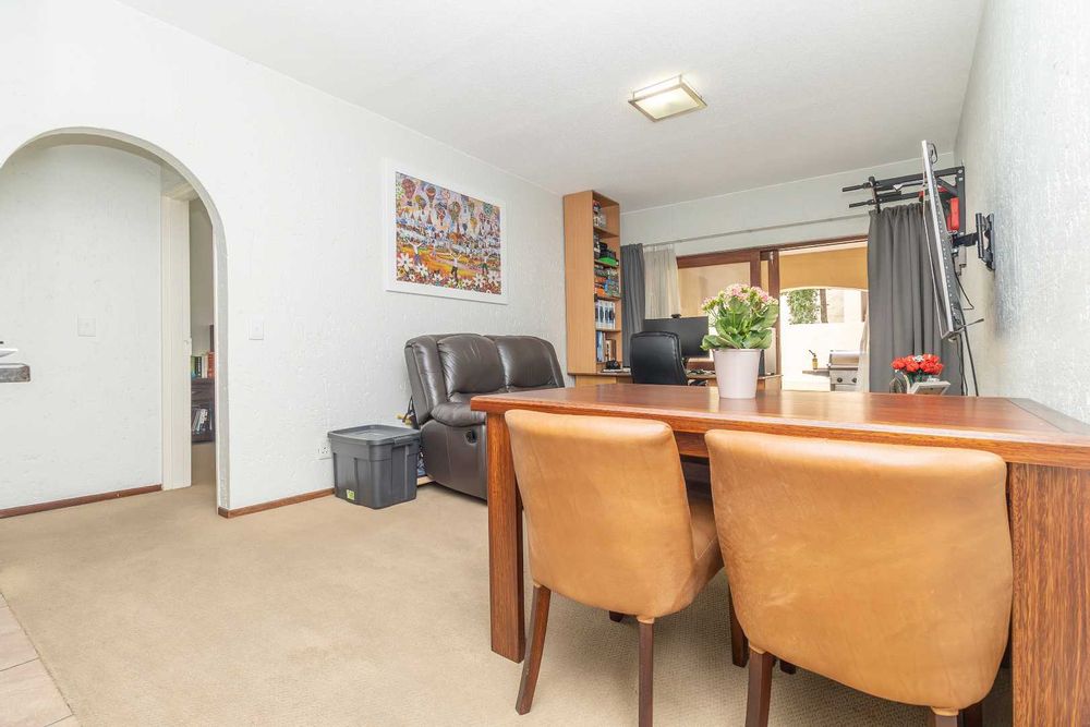 Living Area set up with dining area view to garden