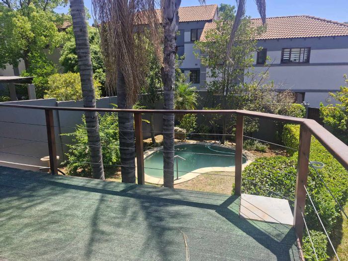 Townhouse To Rent in Sandton Central with pool, spacious layout, and outdoor laundromat.