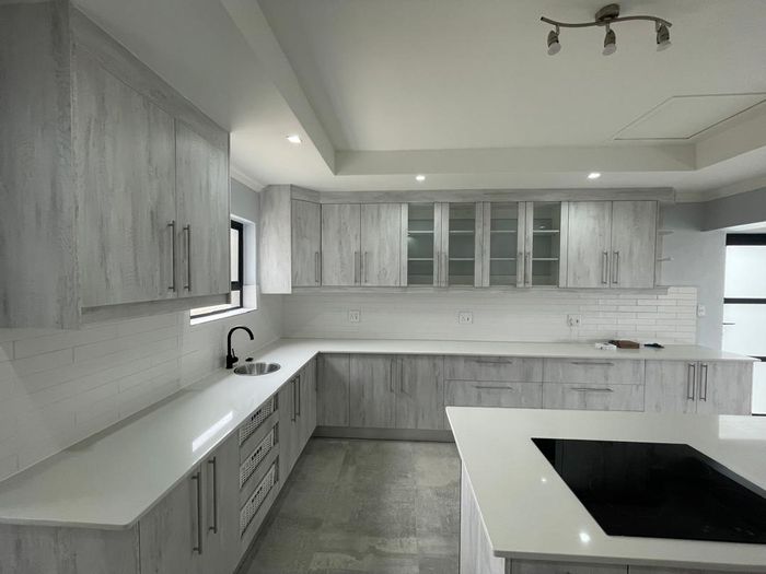 For Sale: House in Mile 4 with 3 bedrooms, BBQ, double garage, and courtyard.
