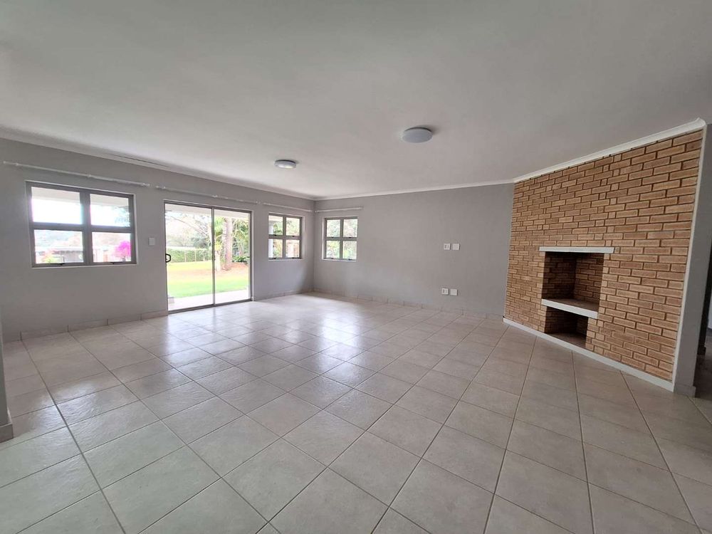 Lounge with fireplace opens onto covered veranda