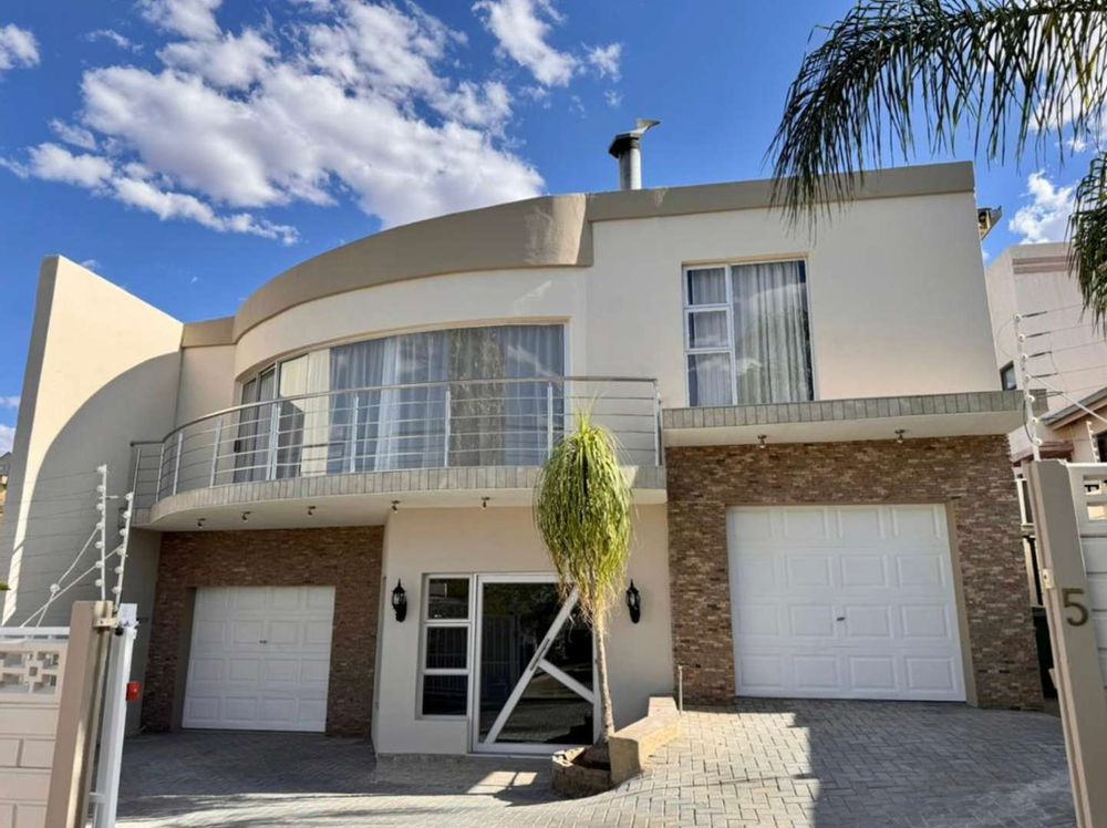 Entrance, and 2 single garages