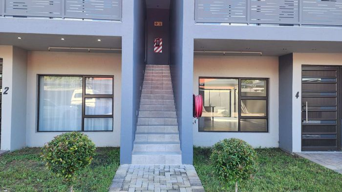 For Sale: 2-bedroom apartment in Rustenburg Central with balcony and covered parking.