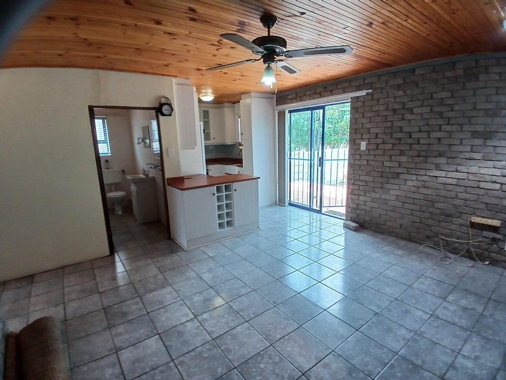 Same Living Area, Kitchen (at the back), Bathroom (on our left) and rear Entrance.