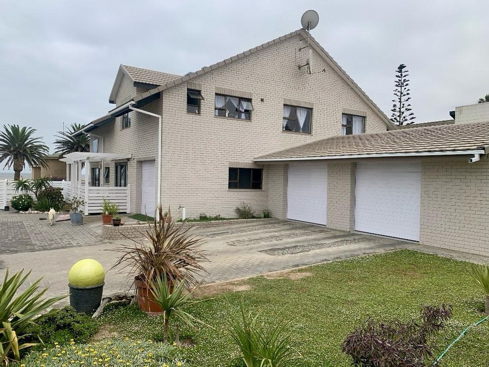 View of the back of the house that also shows the double garage