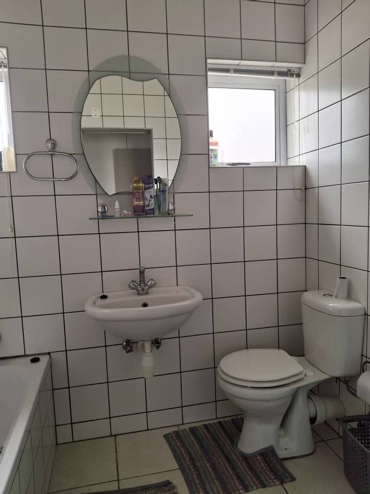 En-suite with bat, basin, toilet and shower
