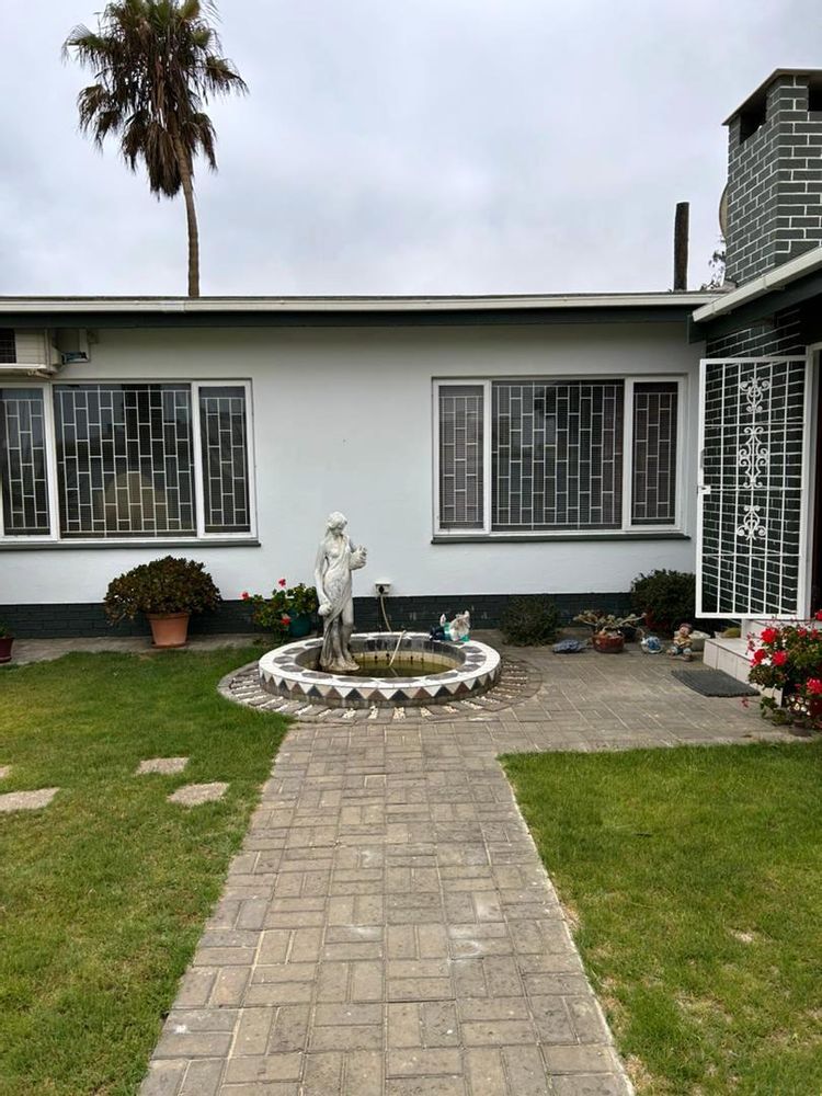 Front of house with well established garden in front