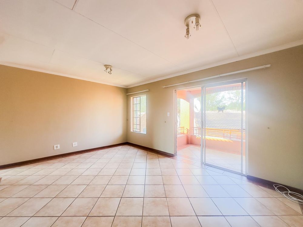 Spacious Living Area leading to balcony
