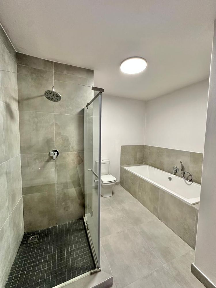 Bathroom with shower and bath