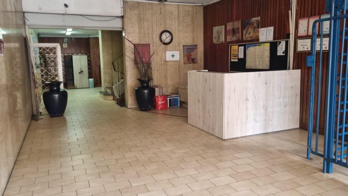 39sqm Bachelor Apartment For Sale in Braamfontein with balcony, parking, and security.