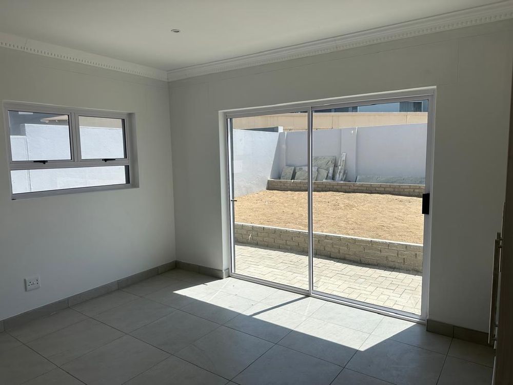 Main bedroom sliding doors leading to outside