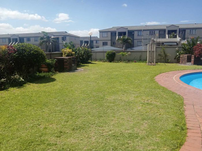 2-Bedroom Apartment For Sale in North Beach with balcony and communal pool.