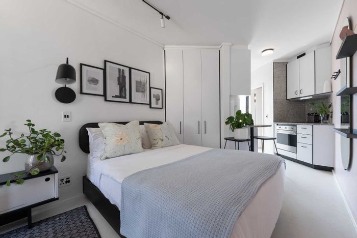 Sea Point Apartment For Sale: Airbnb-ready, rooftop BBQ, 24/7 concierge service.