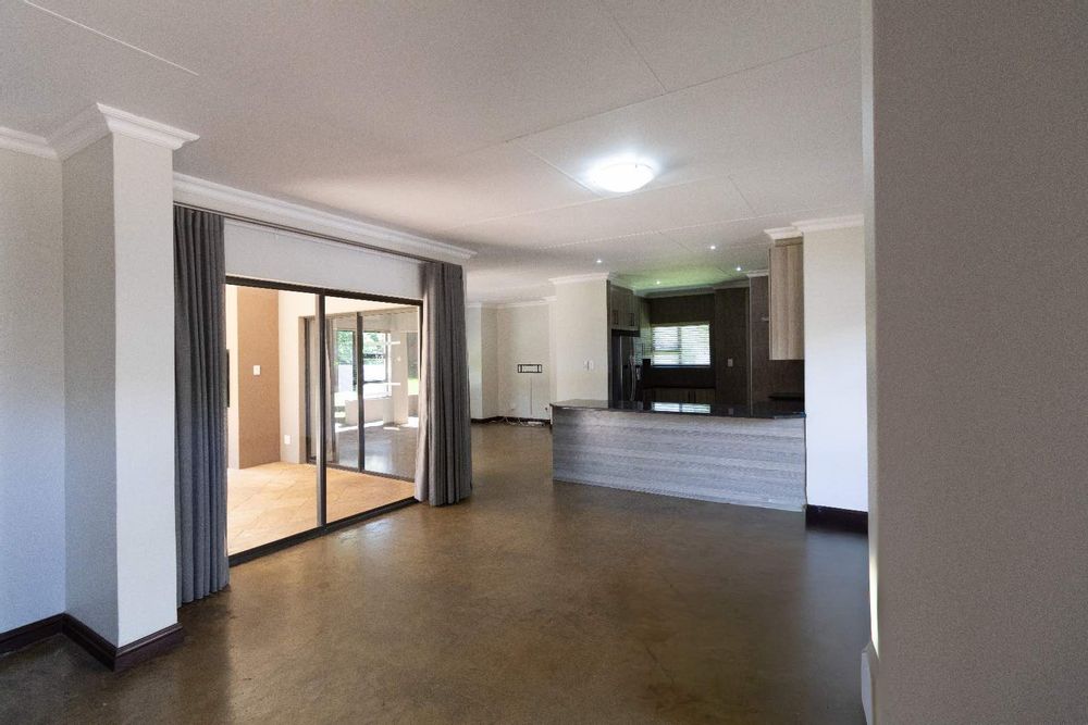 Open-plan dining area with sliding door to patio