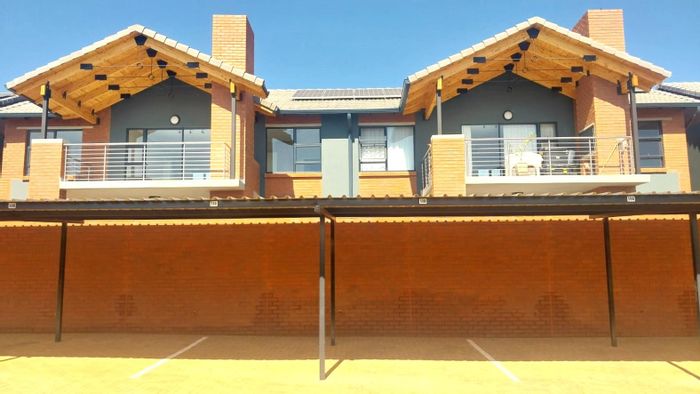 For Sale: Townhouse in Olympus with 2 beds, private patio, and secure parking.