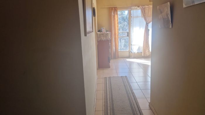 Spacious Turffontein Apartment For Sale: 1 Bedroom, Balcony, Secure Parking.