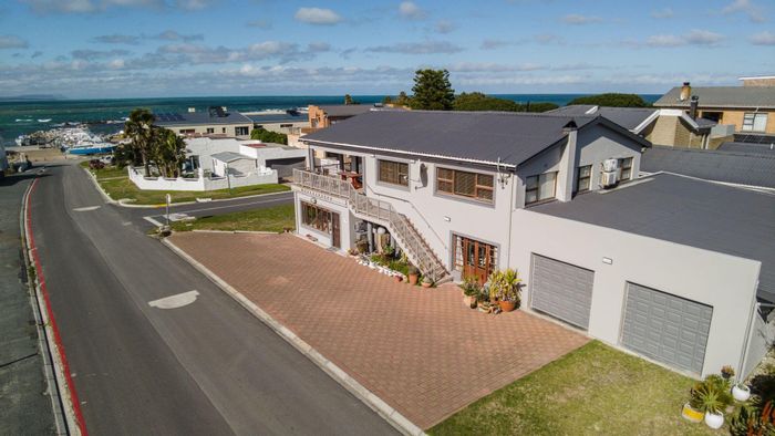 Kleinbaai House For Sale: 5 bedrooms, dual garages, balcony, near harbour activities.