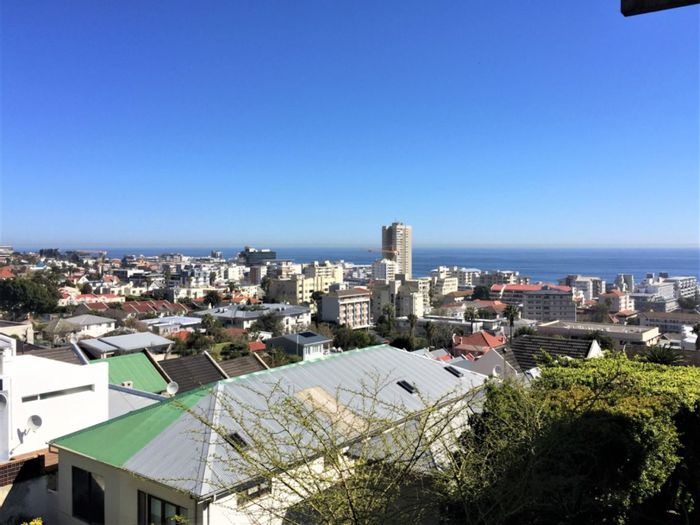 Sea Point Apartment For Sale: Ocean views, off-street parking, Airbnb-friendly.