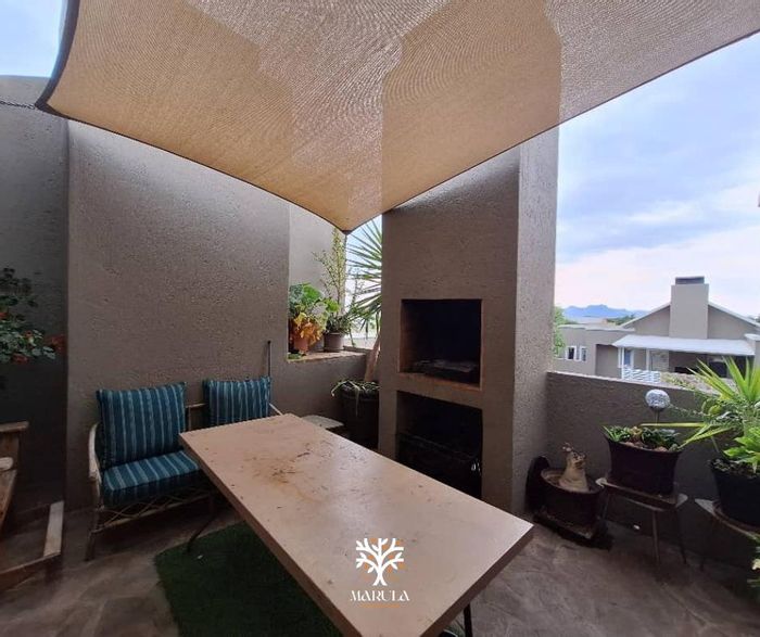 Townhouse for Sale in Omeya Golf Estate: 2 beds, balcony, garage, secure living.