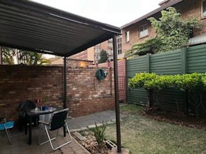 For Sale: Spacious 3-bedroom apartment in Wonderboom South with secure garage and outdoor area.