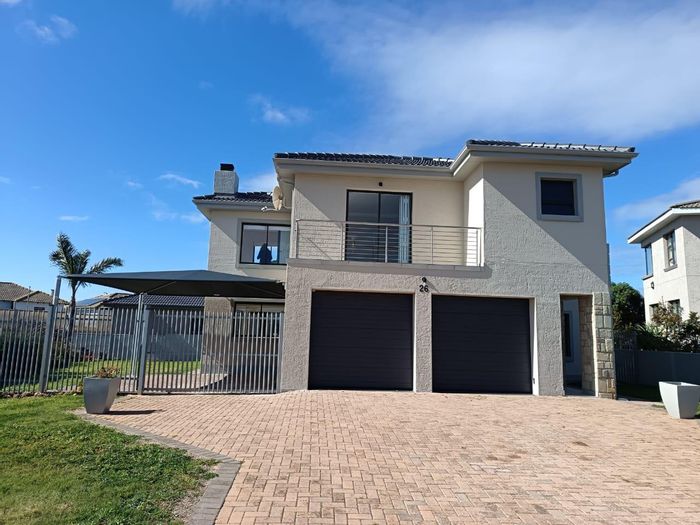 For Sale: House in Hartenbos Heuwels with braai room, balconies, and double garage.