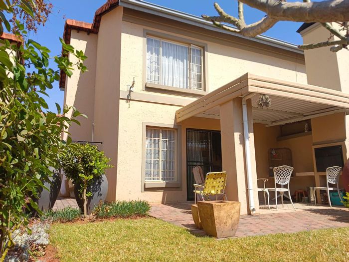 For Sale: 2-bedroom townhouse in Equestria with patio, garden, and garage.