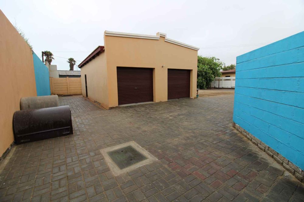 Backyard with 2 garages and storeroom