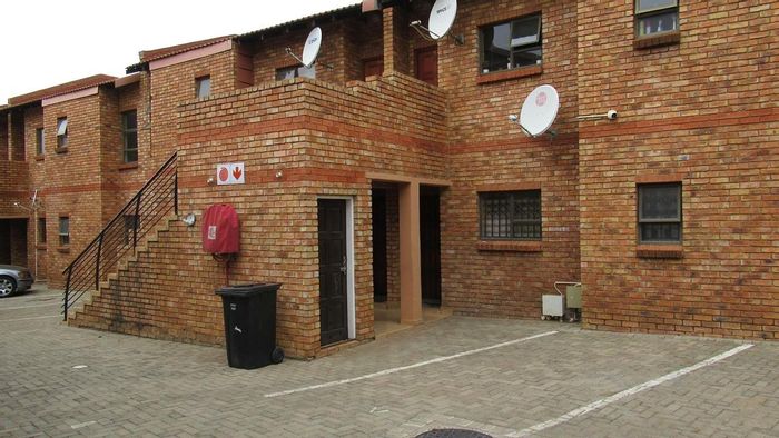 For Sale: Townhouse in Naturena with open-plan living, balcony, and 24hr security.