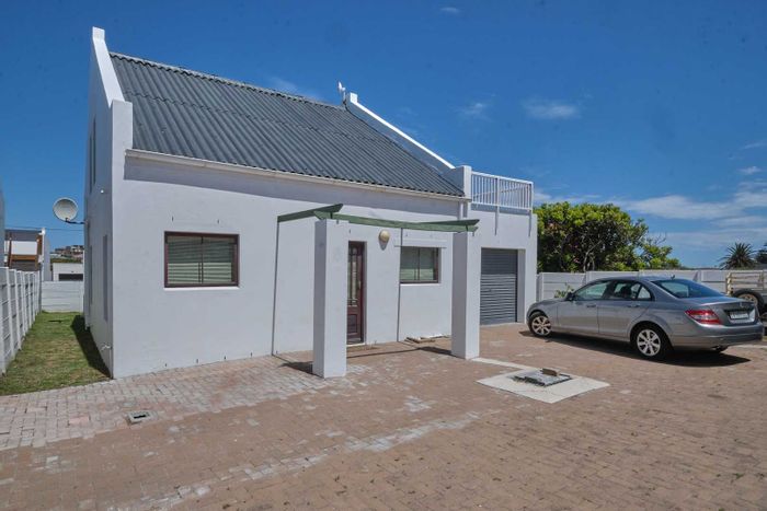 House for Sale in Yzerfontein Central: Double-story, garage access, sea views, patio.