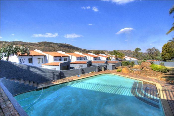 For Sale: Mondeor Townhouse with private garden, garage, and communal pool access.