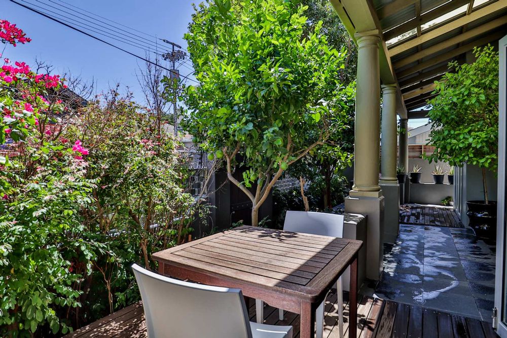pretty terrace under a lemon tree for outside dining and relaxation