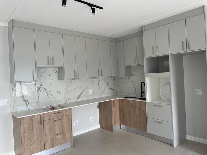 For Sale: Spacious 3-bedroom apartment in Sandown with secure parking and garden views.
