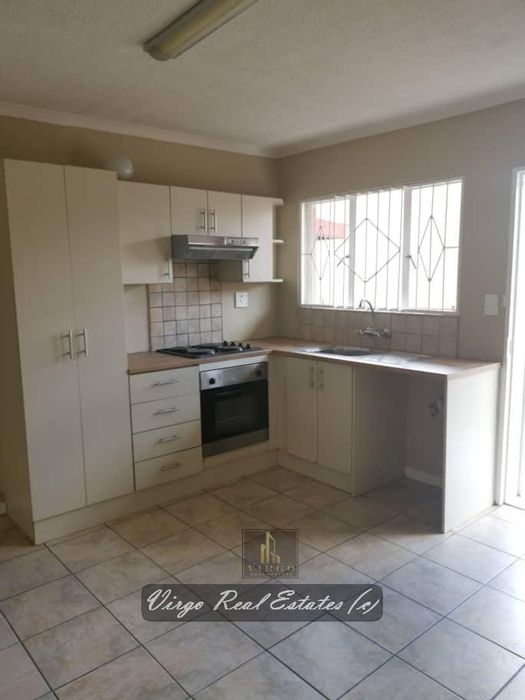 2-Bedroom Apartment in Otjomuise For Sale, includes parking and open plan living.
