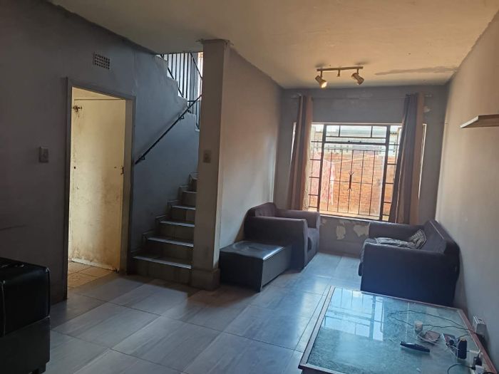 3-Bedroom Townhouse for Sale in Vrededorp with yard, garage, and security features.