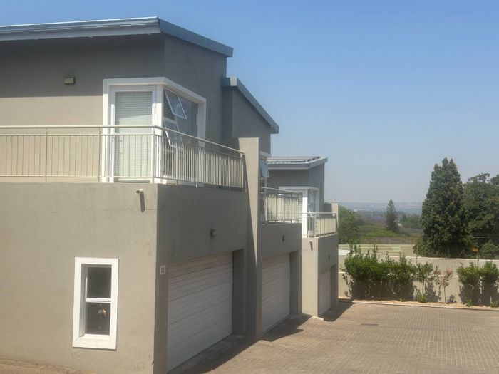 For Sale: Bryanston West Townhouse with 3 en suite bedrooms, pool, double garage.