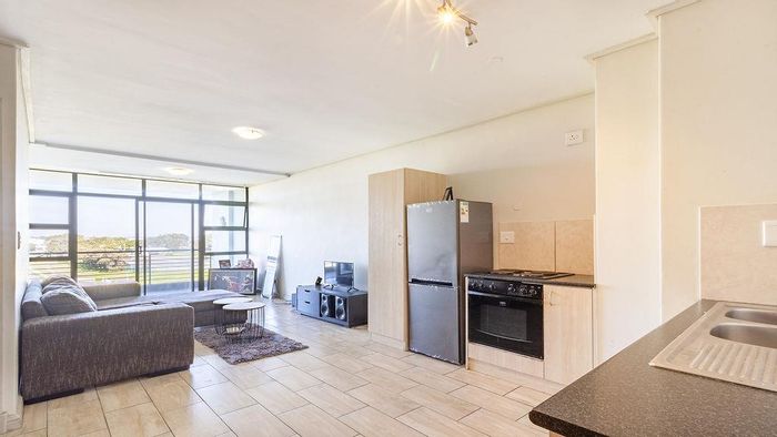 For Sale: Apartment in Milnerton Central with 2 beds, balcony, and open-plan living.