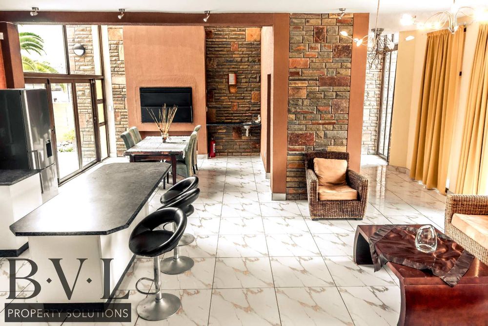 Open plan kitchen with indoor BBQ & Dining area