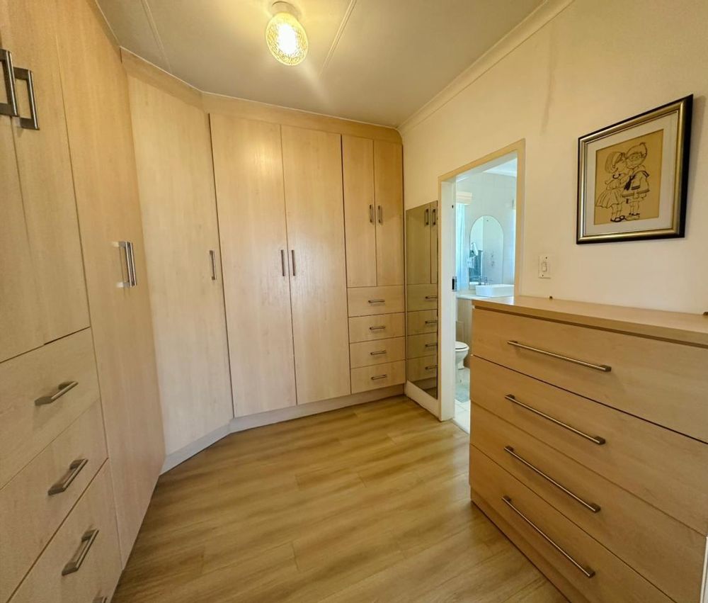Main bedroom built-in cupboards dressing room to en-suite bathroom