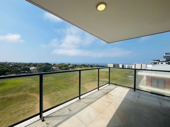 Umhlanga Ridge Apartment To Rent: 2 beds, sea views, wrap-around balcony, communal pool.