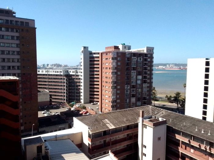 Apartment for Sale in Durban Central: 2.5 bedrooms, security, parking, rental income.