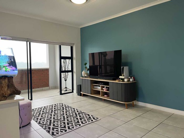 Ballito Central Apartment To Rent: Scenic views, pool, gym, and outdoor braai.