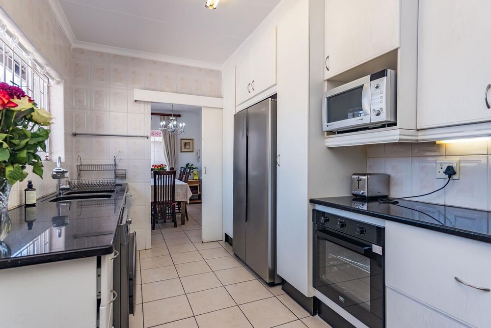 Spacious kitchen and two undercover ovens,