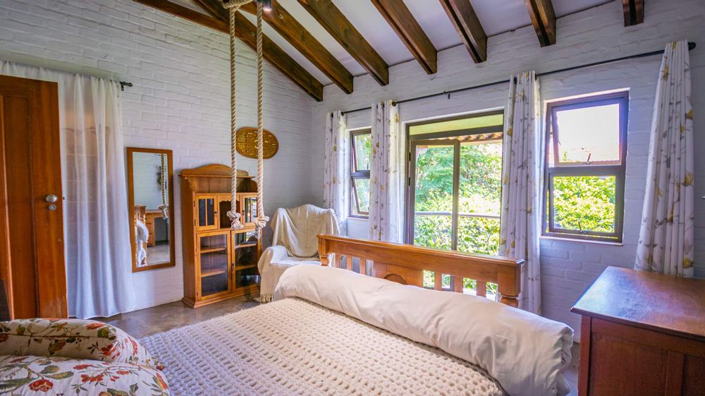 2nd large bedroom with Juliet balcony over garden and a lovely treed view