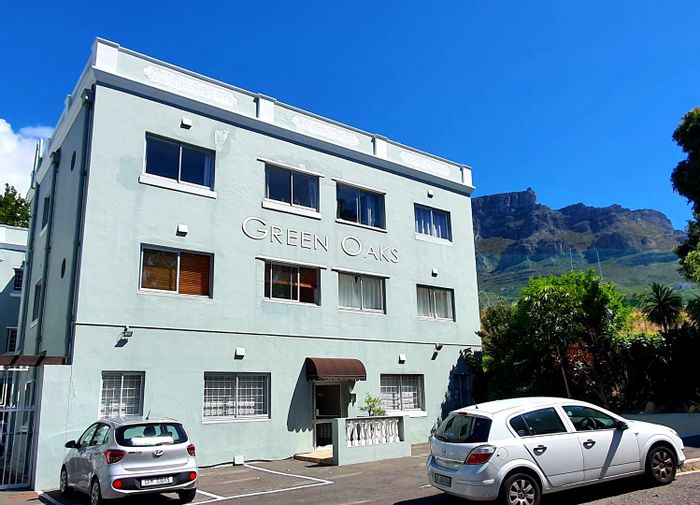 Oranjezicht Apartment To Rent: Garden, parking bay, mountain views, secure block access.