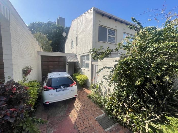 4-Bedroom Townhouse To Rent in Umhlanga Rocks Central with private patio and bar.