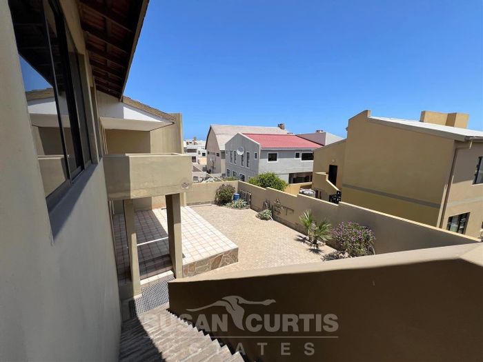 House For Sale in Long Beach: Spacious layout, outdoor patio, and granny flat included.