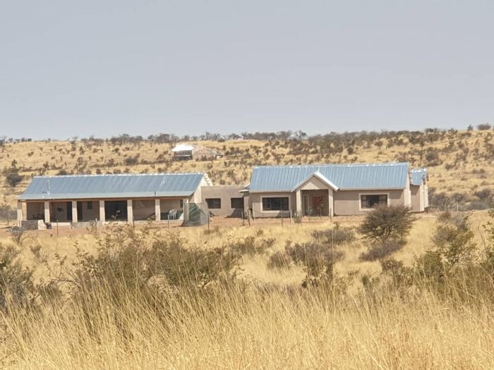 For Sale: House in Windhoek Central with dual dwellings, solar system, and borehole.