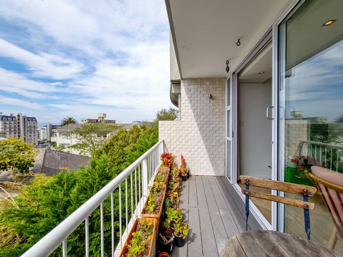 For Sale: Green Point Apartment, 2 beds, balcony views, park access, secure parking.