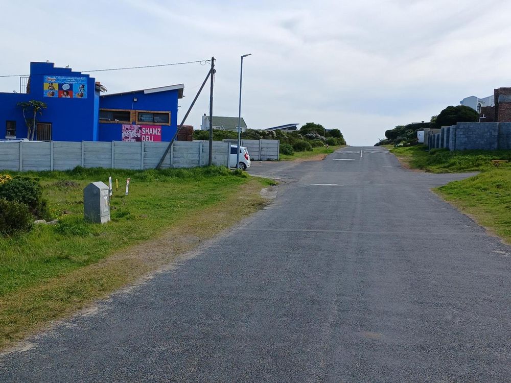 Our Plot on our left - with the Cafe/Bakery behind it. Down the Street (direction of Sea).